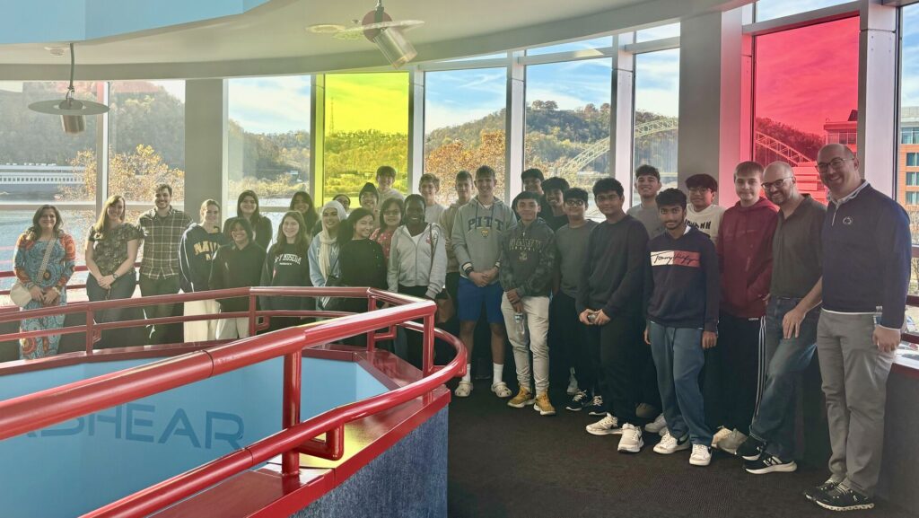 group of students posing in hallway