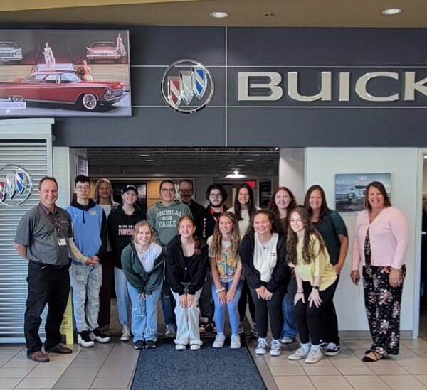 The Cambria/Somerset group poses for a picture at Thomas Automotive