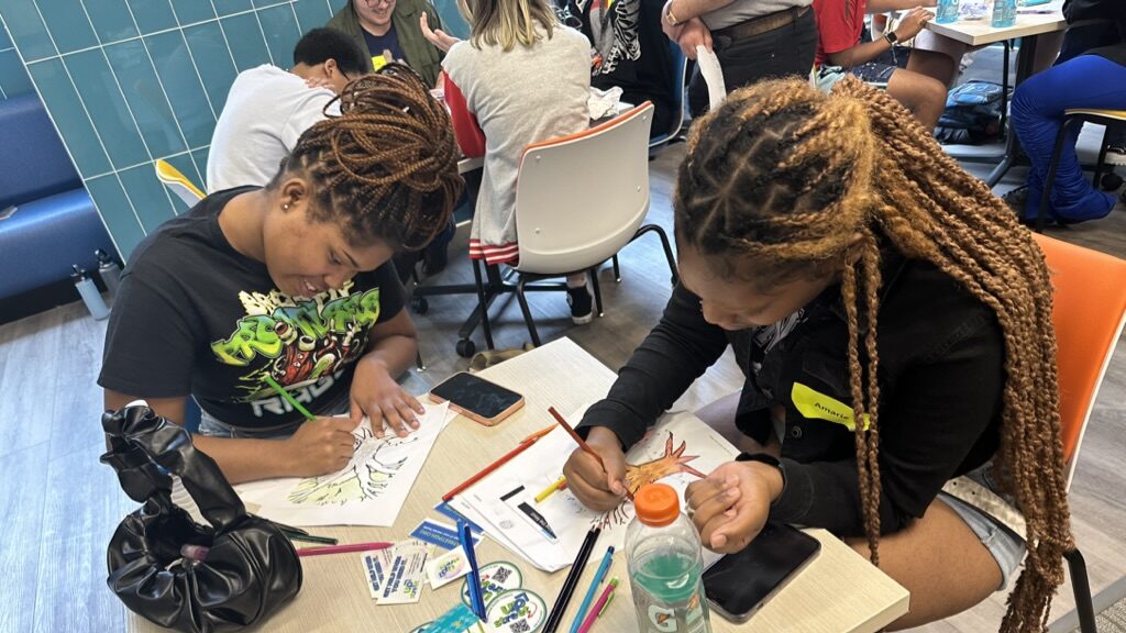 Summer Program learners work at a table