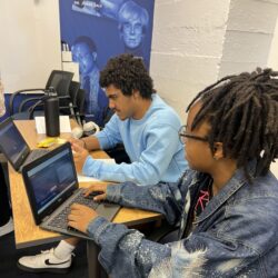 Two students working on computers.