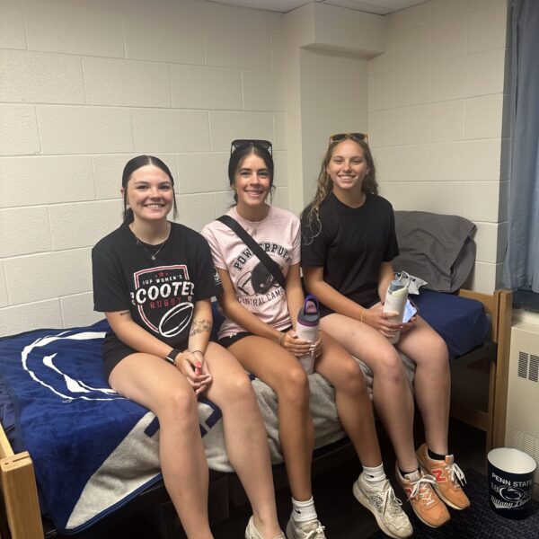 three girls sitting on dorm bed at Penn State Altoona