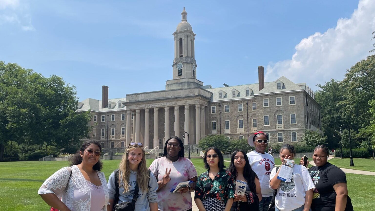 Central PA learners pose in front of Old Main on the Penn State University Park campus