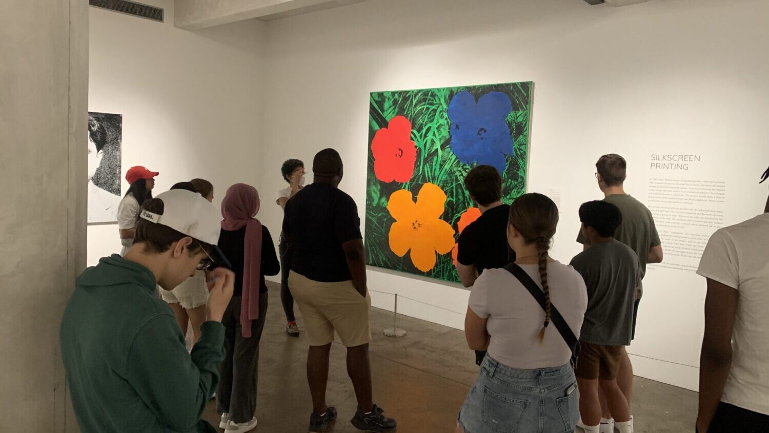 student group from back looking at paintings at warhol museum