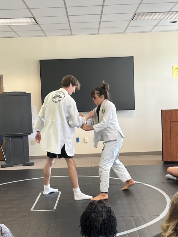 student and instructor doing jiu jitsu