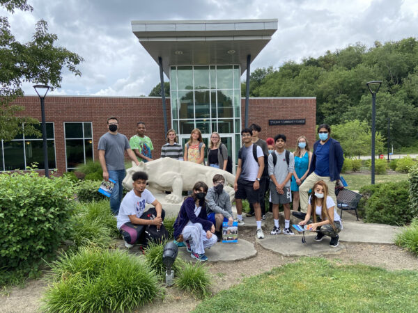 Students surrounding Penn State lion shrine