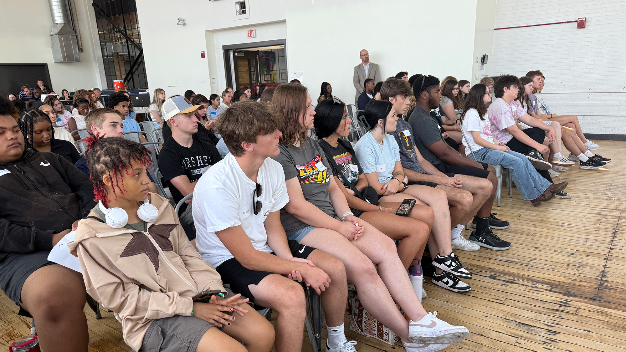 Summer Discovery students listen to a speaker at the Energy Innovation Center
