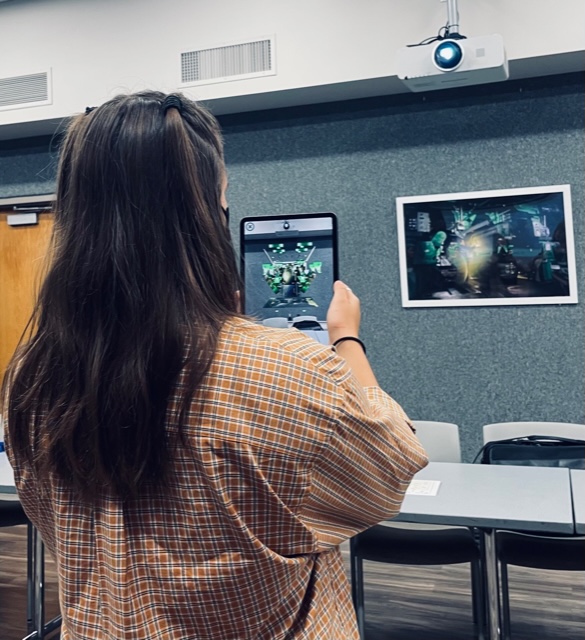Female student expeiments with augmented reality in a Penn State New Kensington lab