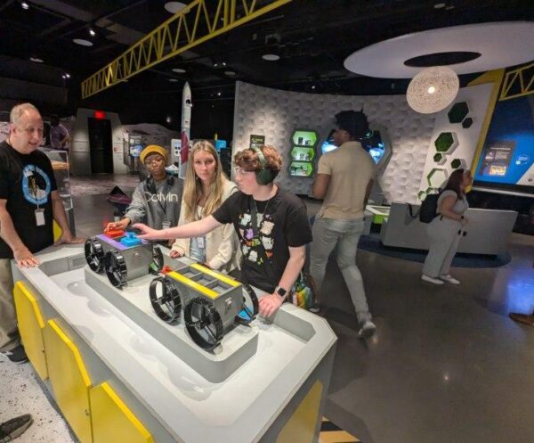 Students explore interactive exhibits at the Moonshot Museum.