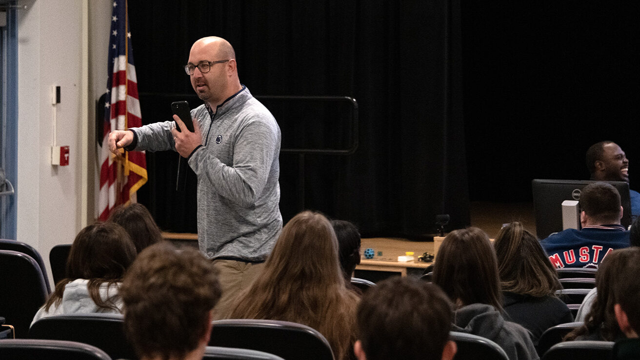 Justin Aglio speaking at a workshop for high school students