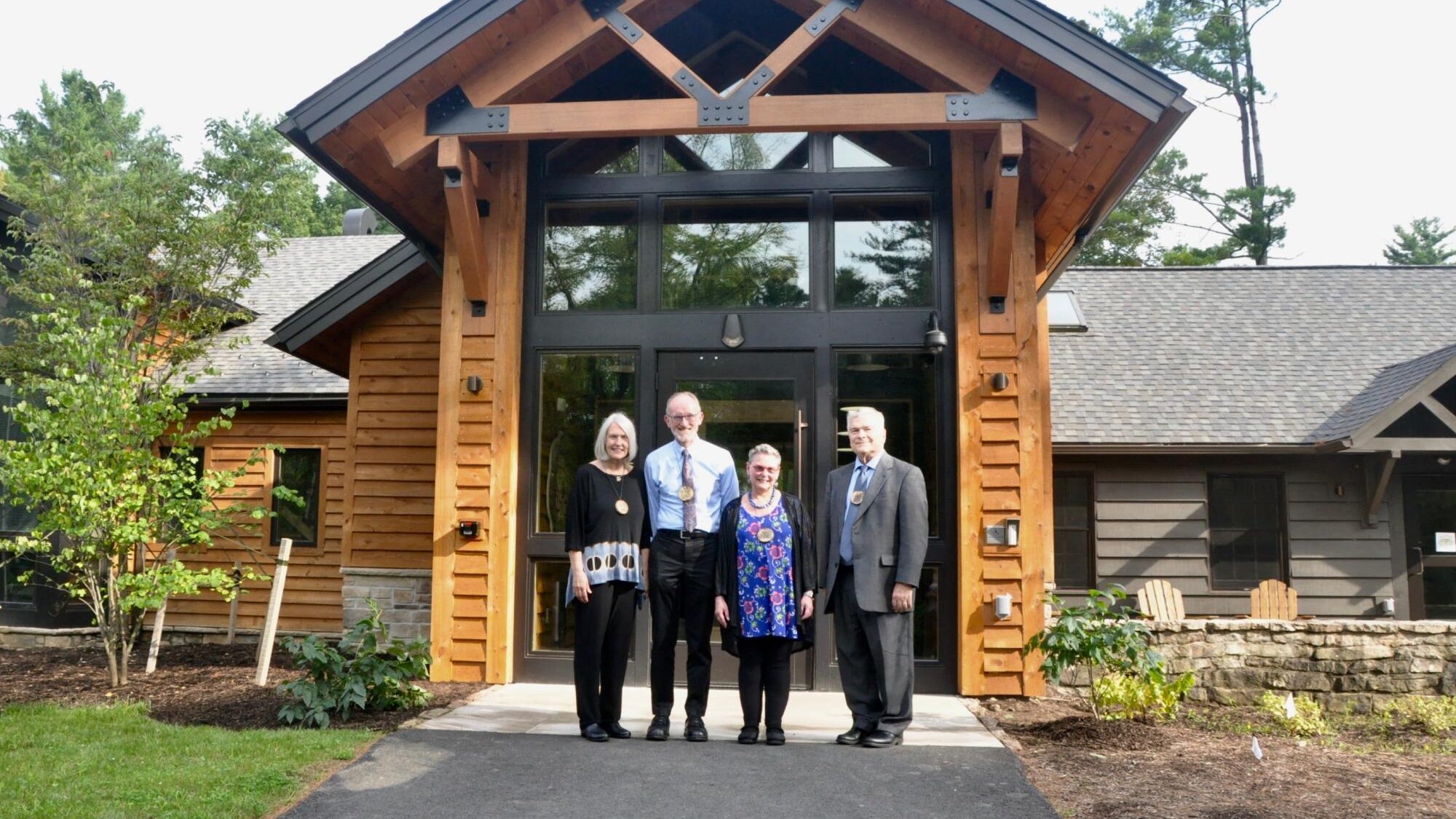Mary Ellen and Tom Litzinger, Penn State President Eric Barron and his wife, Molly, in front of Shaver's Creek Environmental Center Photo Credit Trish Hummer